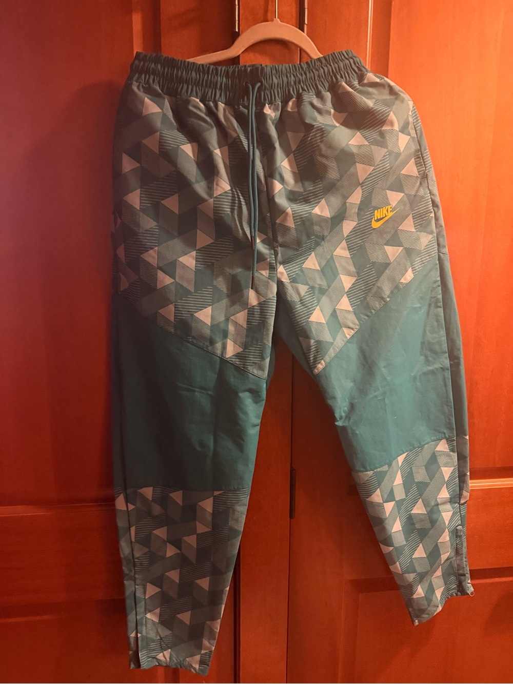 Nike woman’s  Teal Geometric Joggers with Yellow Logo